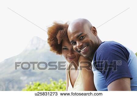 Couple relaxing outdoors View Large Photo Image Stock Image - Couple relaxing outdoors. Fotosearch