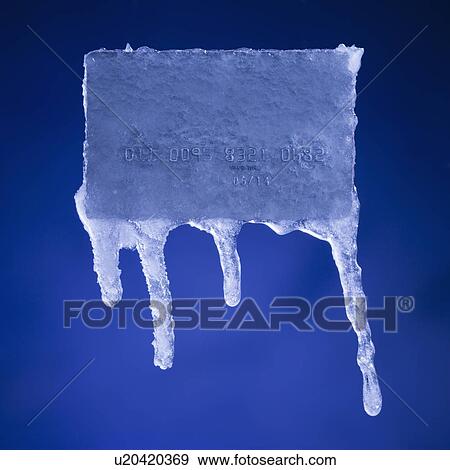 Stock Photo - Credit card covered in ice. Fotosearch