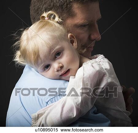 Stock Photography - Daughter hugging father. Fotosearch