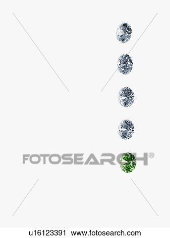 Diamonds and an emerald View Large Photo Image Stock Image - Diamonds and an emerald. Fotosearch