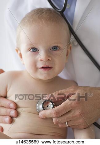 Doctor and baby View Large Photo Image Stock Photo - Doctor and baby. Fotosearch