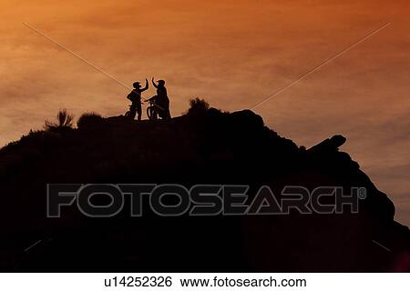 Stock Photograph - Downhill mountain bikers. Fotosearch