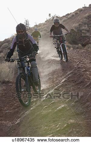 Stock Photography - Downhill mountain bikers. Fotosearch