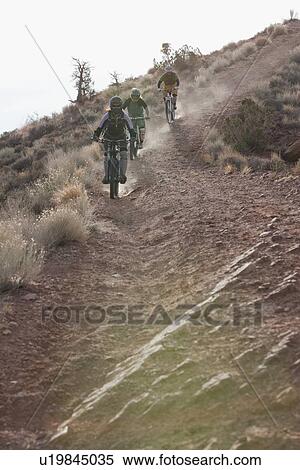 Downhill mountain bikers View Large Photo Image Stock Photography - Downhill mountain bikers. Fotosearch