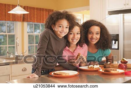 Picture - Eating peanut butter sandwiches. Fotosearch