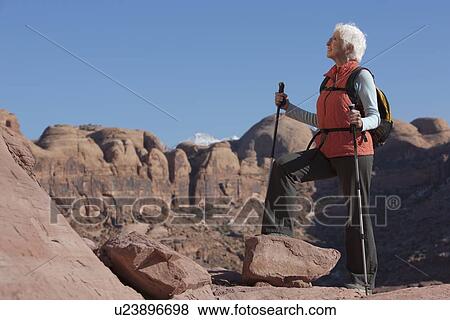 Stock Photo - Elderly hiker in canyon. Fotosearch