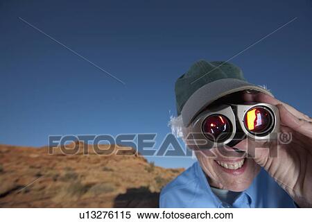 Elderly woman looking through binoculars View Large Photo Image Stock Photography - Elderly woman looking through binoculars. Fotosearch