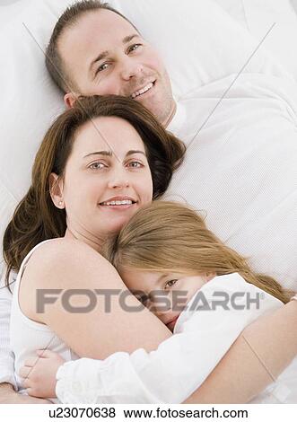 Stock Photo - Family cuddling. Fotosearch
