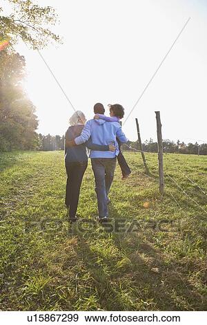 Family going for a walk View Large Photo Image Stock Photo - Family going for a walk. Fotosearch