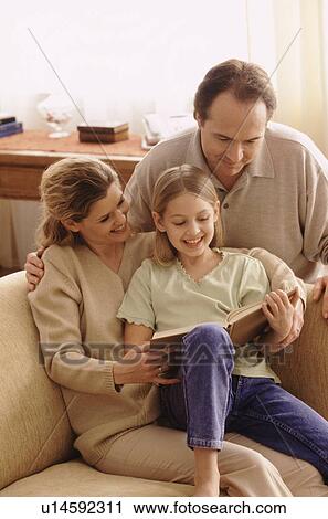 Stock Image - Family reading together. Fotosearch