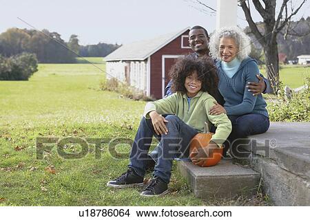 Family sitting on porch View Large Photo Image Picture - Family sitting on porch. Fotosearch