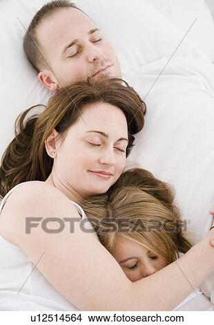 Family sleeping together View Large Photo Image Picture - Family sleeping together. Fotosearch