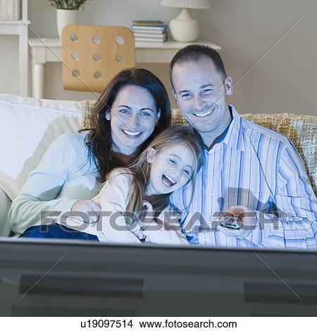 Picture - Family watching television. Fotosearch