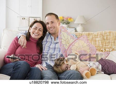 Stock Photo - Family watching television. Fotosearch
