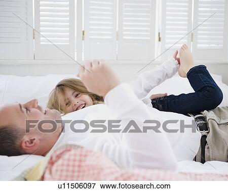 Father and daughter playing View Large Photo Image Stock Photo - Father and daughter playing. Fotosearch