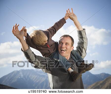 Stock Image - Father and son outdoors. Fotosearch