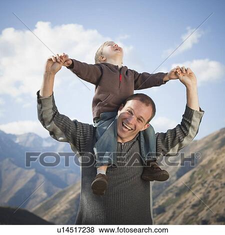 Father and son outdoors View Large Photo Image Stock Photo - Father and son outdoors. Fotosearch