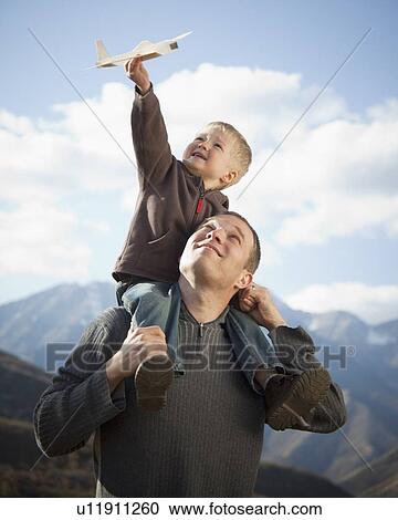 Father and son playing View Large Photo Image Stock Image - Father and son playing. Fotosearch
