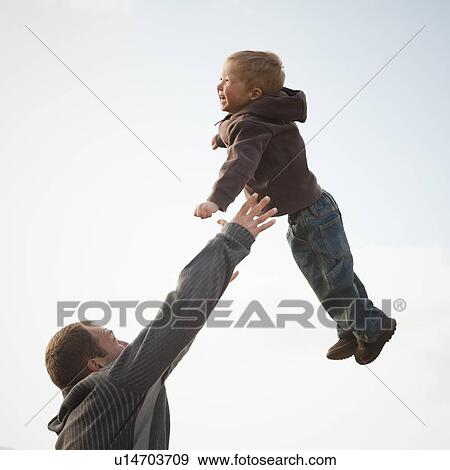 Stock Photo - Father and son playing. Fotosearch