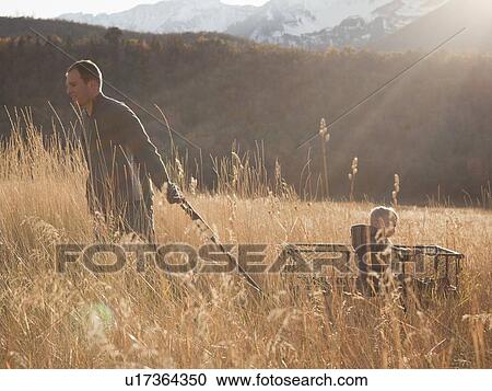 Father pulling son in wagon View Large Photo Image Stock Image - Father pulling son in wagon. Fotosearch
