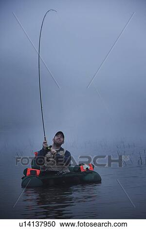 Stock Image - Fly fishing. Fotosearch