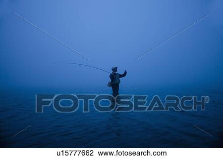 Stock Image - Fly fishing. Fotosearch
