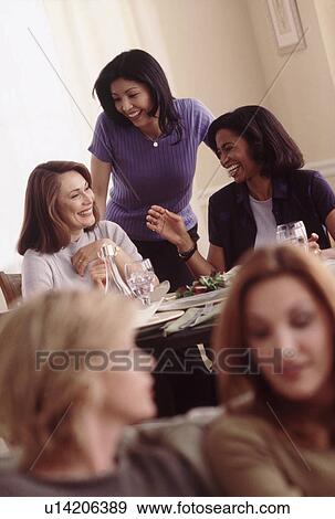 Stock Photo - Friends at a dinner party. Fotosearch