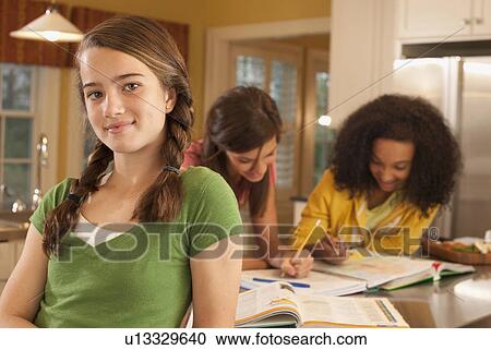Friends doing homework View Large Photo Image Stock Image - Friends doing homework. Fotosearch