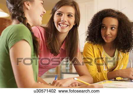Friends doing homework View Large Photo Image Stock Image - Friends doing homework. Fotosearch