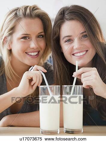 Stock Photography - Friends drinking milk. Fotosearch