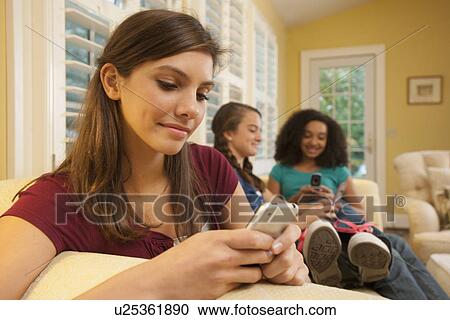 Friends texting View Large Photo Image Stock Image - Friends texting. Fotosearch
