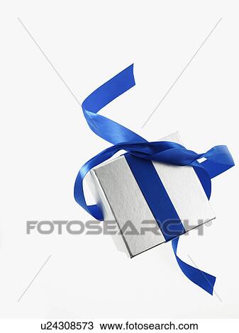 Stock Image - Gift and blue ribbon. Fotosearch