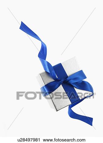 Stock Image - Gift and blue ribbon. Fotosearch