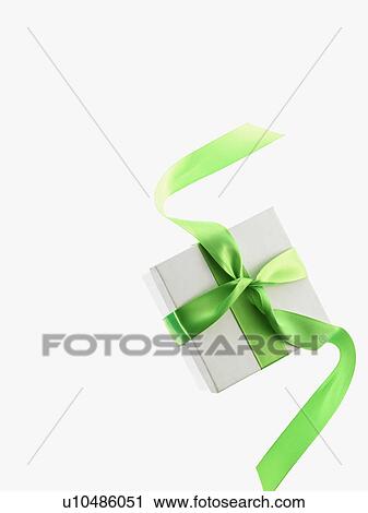 Stock Image - Gift and green ribbon. Fotosearch