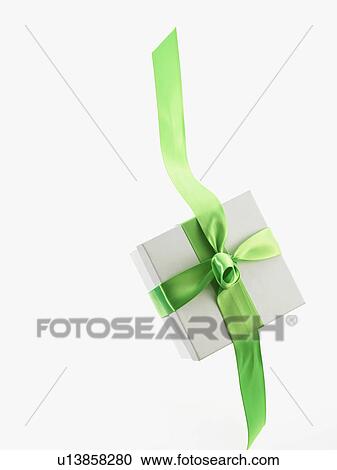 Stock Image - Gift and green ribbon. Fotosearch