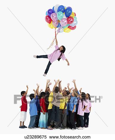 Girl floating away with balloons View Large Photo Image Stock Photography - Girl floating away with balloons. Fotosearch