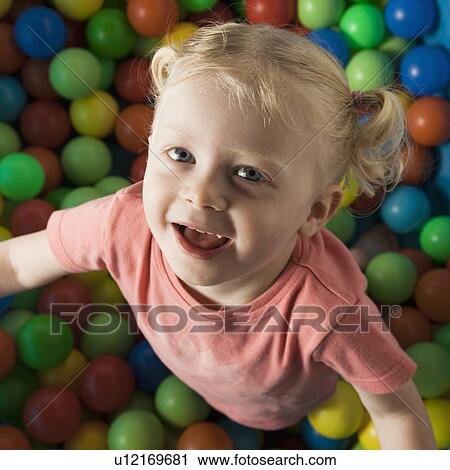 Girl playing in ball room View Large Photo Image Stock Image - Girl playing in ball room. Fotosearch