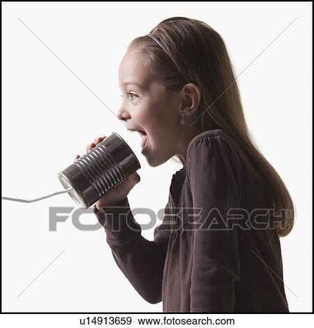 Girl playing with tin can phone View Large Photo Image Stock Photo - Girl playing with tin can phone. Fotosearch