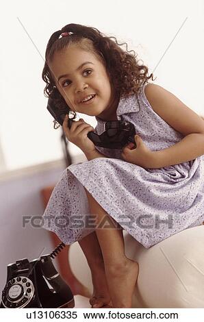 Stock Photography - Girl talking on phone. Fotosearch