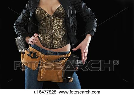 Hair stylist wearing a tool belt View Large Photo Image Stock Photo - Hair stylist wearing a tool belt. Fotosearch