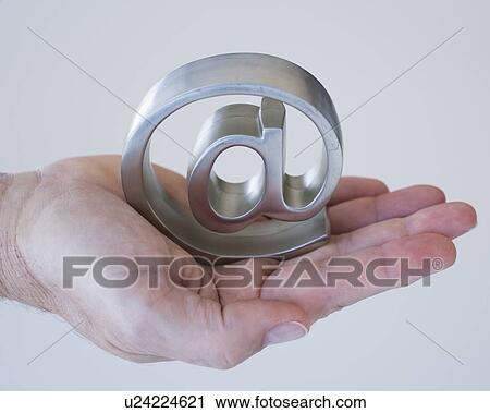 Hand holding at symbol View Large Photo Image Stock Image - Hand holding at symbol. Fotosearch