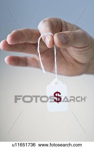 Hand holding sale tag View Large Photo Image Stock Photograph - Hand holding sale tag. Fotosearch