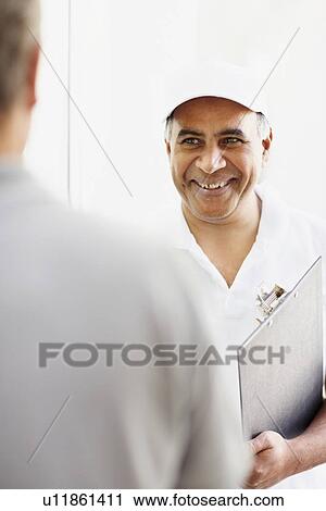 Handyman talking to customer View Large Photo Image Stock Image - Handyman talking to customer. Fotosearch