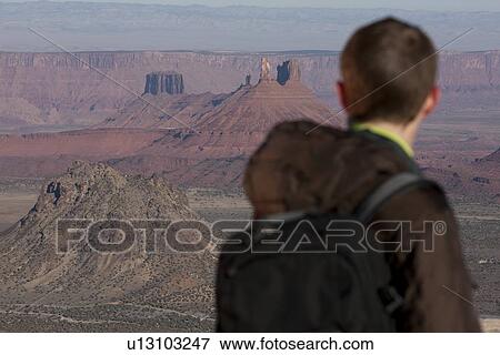 Stock Photo - Hiker at top of canyon. Fotosearch