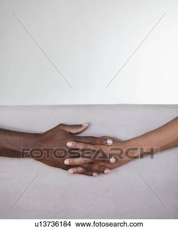 Picture - Holding hands. Fotosearch
