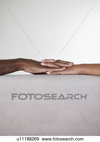Holding hands View Large Photo Image Stock Photo - Holding hands. Fotosearch