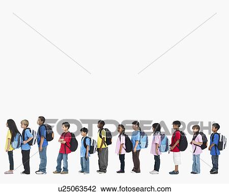 Stock Image - Line of children wearing backpacks. Fotosearch