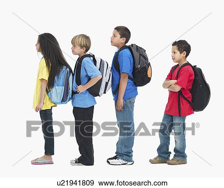 Stock Photo - Line of children wearing backpacks. Fotosearch