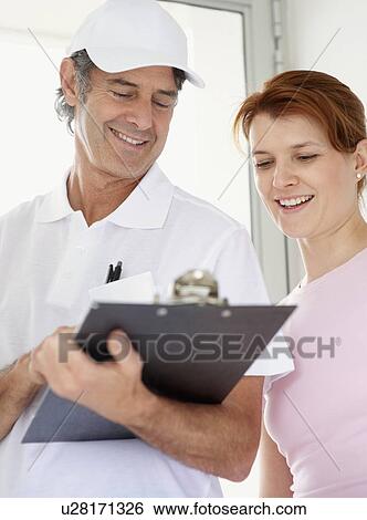 Looking at the bill View Large Photo Image Stock Photograph - Looking at the bill. Fotosearch