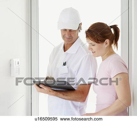 Looking at the bill View Large Photo Image Stock Photography - Looking at the bill. Fotosearch
